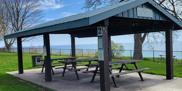 Number 2 picnic shelter with picnic tables at Kiwanis Heydenshore Park.